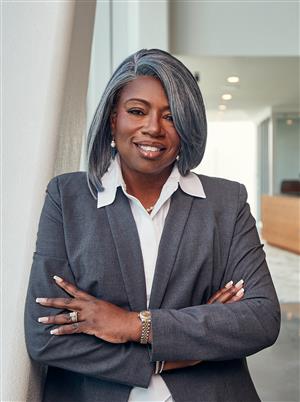 Dr. Jamie C Polk standing with arms crossed